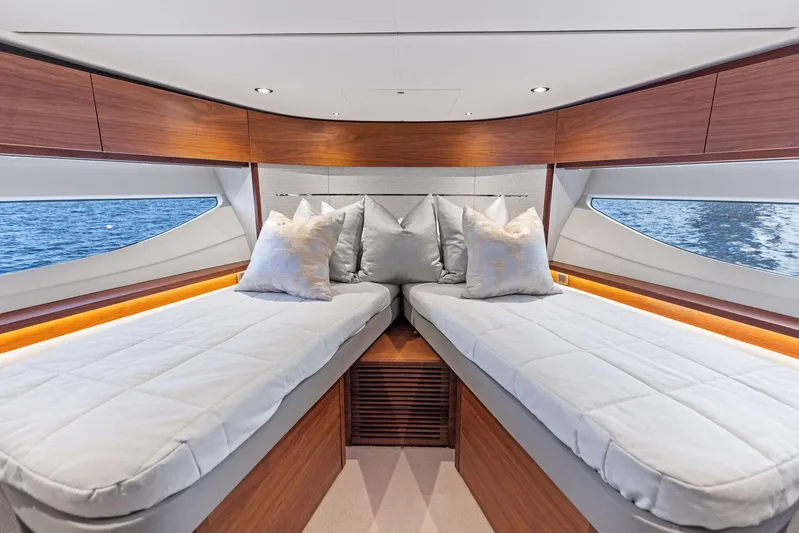 Endless Summer Yacht Photos Pics Luxurious interior of 2020 Princess V55 yacht with twin beds and ocean view.