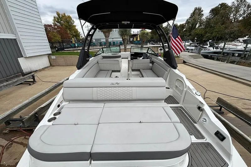  Yacht Photos Pics 2023 Sea Ray SDX 270 Outboard boat with spacious seating and sleek design at a marina.