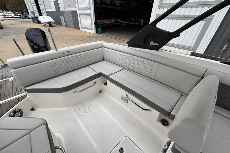  Yacht Photos Pics 2023 Sea Ray SDX 270 Outboard boat interior with gray seating and storage compartments.
