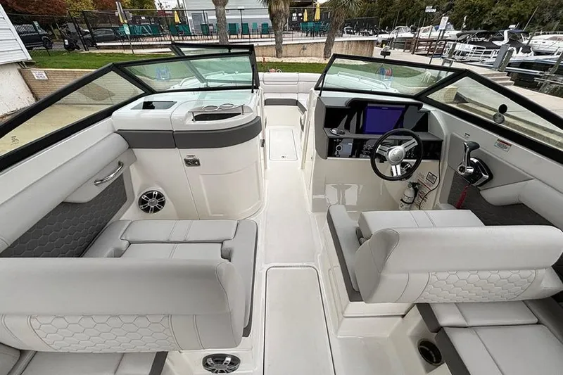  Yacht Photos Pics 2023 Sea Ray SDX 270 Outboard boat interior with modern seating and dashboard.