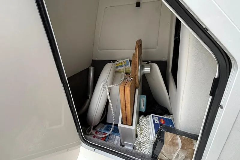  Yacht Photos Pics Storage compartment of 2023 Sea Ray SDX 270 Outboard with various boating accessories.