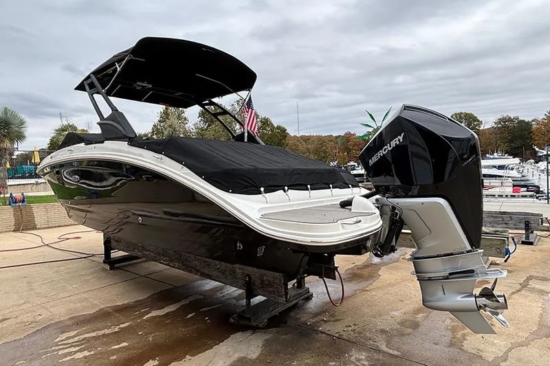  Yacht Photos Pics 2023 Sea Ray SDX 270 Outboard boat with Mercury engine on a dock.
