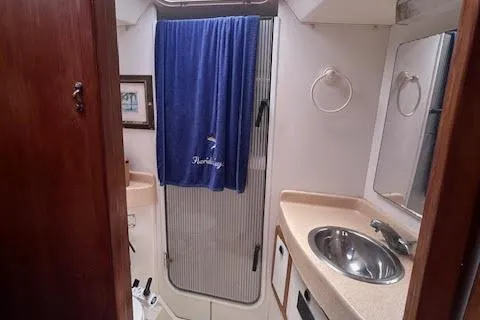 Otter Yacht Photos Pics Bathroom interior of 2000 Catalina 42 Mk II sailboat with sink and shower.