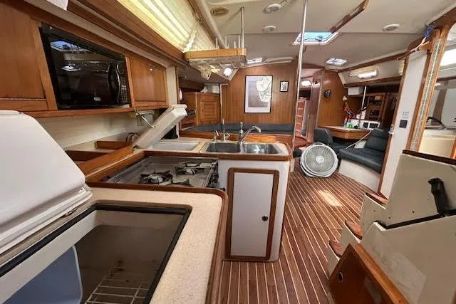 Otter Yacht Photos Pics Interior of a 2000 Catalina 42 Mk II sailboat with wood finish and modern amenities.