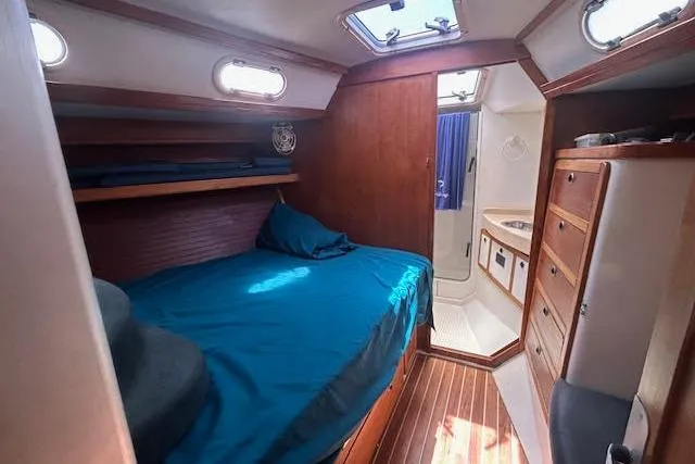 Otter Yacht Photos Pics Cozy cabin interior of 2000 Catalina 42 Mk II sailboat with bed and bathroom.
