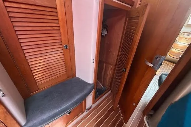 Otter Yacht Photos Pics Interior of 2000 Catalina 42 Mk II sailboat with wooden cabinets and seating.