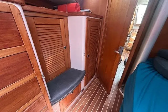 Otter Yacht Photos Pics Interior of 2000 Catalina 42 Mk II sailboat with wooden cabinets and seating.