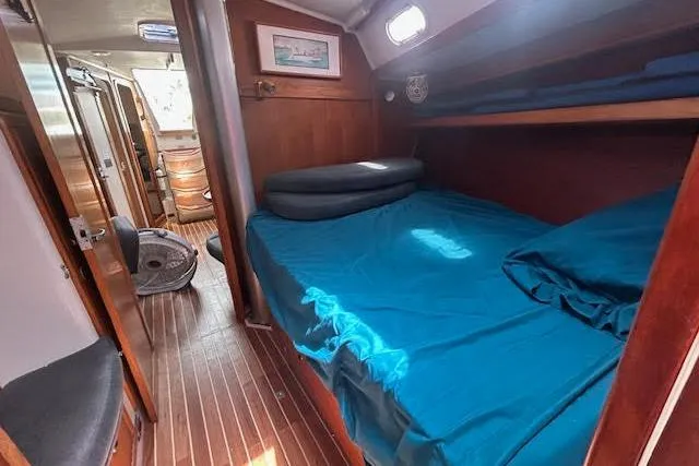 Otter Yacht Photos Pics Interior of 2000 Catalina 42 Mk II sailboat with cozy cabin and wooden flooring.
