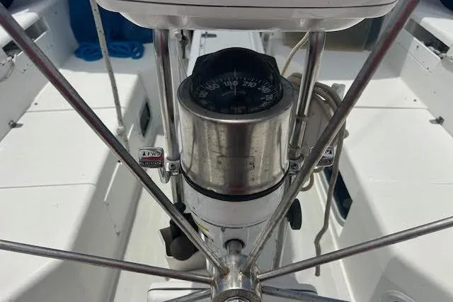 Otter Yacht Photos Pics Steering wheel and compass on a 2000 Catalina 42 Mk II sailboat.