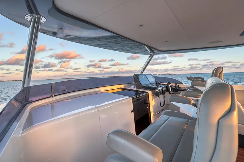 Our Trade Yacht Photos Pics Luxurious 2021 Sirena 88 yacht helm with ocean view at sunset.