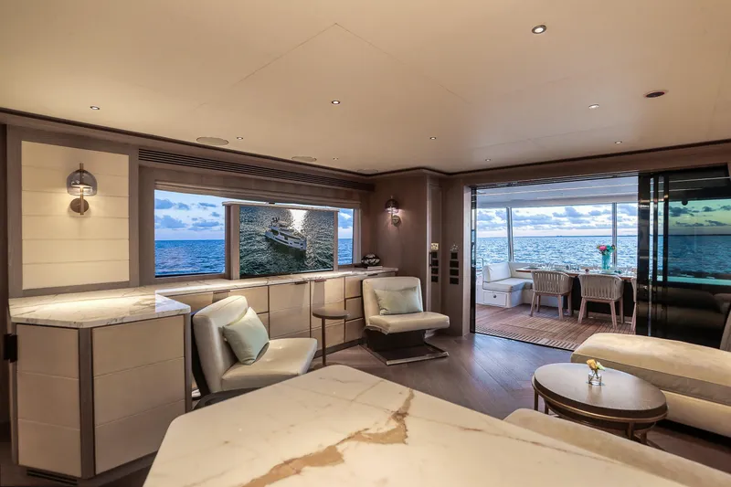 Our Trade Yacht Photos Pics Luxurious interior of 2021 Sirena 88 yacht with ocean view and elegant furnishings.