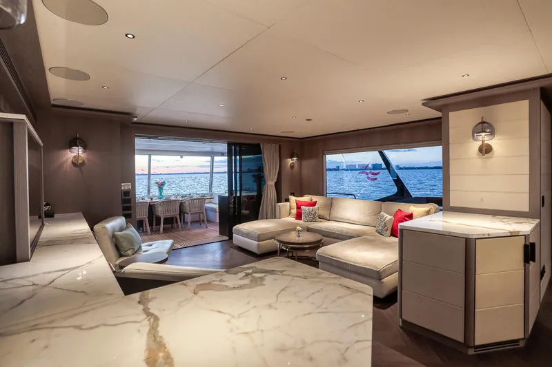 Our Trade Yacht Photos Pics Luxurious interior of 2021 Sirena 88 yacht with elegant seating and ocean view.