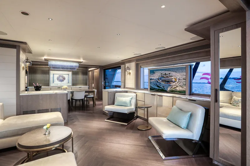 Our Trade Yacht Photos Pics Luxurious interior of 2021 Sirena 88 yacht with elegant seating and large windows.