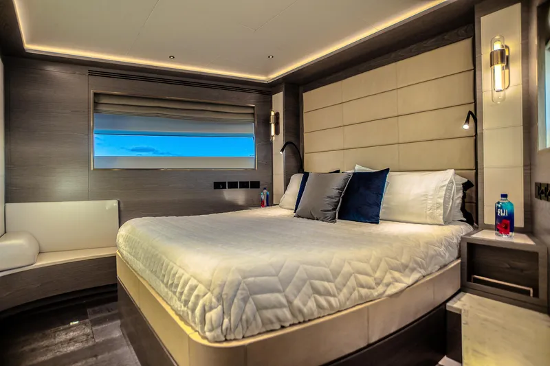 Our Trade Yacht Photos Pics Luxurious bedroom interior of 2021 Sirena 88 yacht with modern design and ambient lighting.