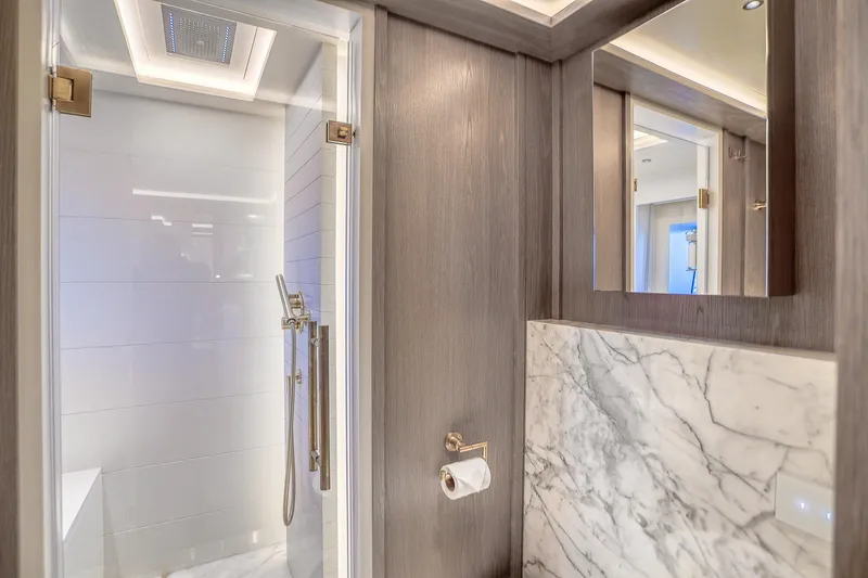 Our Trade Yacht Photos Pics Luxurious bathroom in 2021 Sirena 88 yacht with marble accents and modern fixtures.