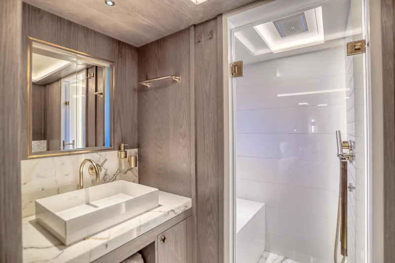 Our Trade Yacht Photos Pics Luxurious bathroom in 2021 Sirena 88 yacht with modern sink and shower.