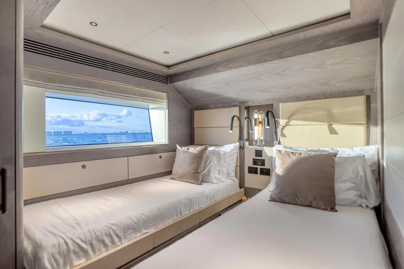 Our Trade Yacht Photos Pics Luxurious Sirena 88 yacht bedroom interior with twin beds and ocean view, 2021 model.