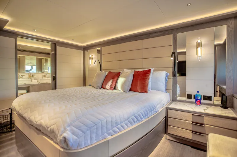Our Trade Yacht Photos Pics Luxurious bedroom interior of 2021 Sirena 88 yacht with modern design and elegant lighting.