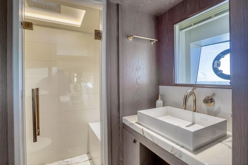 Our Trade Yacht Photos Pics Luxurious bathroom in 2021 Sirena 88 yacht with modern sink and shower.