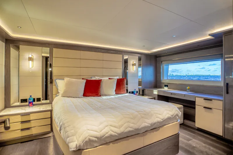 Our Trade Yacht Photos Pics Luxurious bedroom interior of 2021 Sirena 88 yacht with ocean view window.