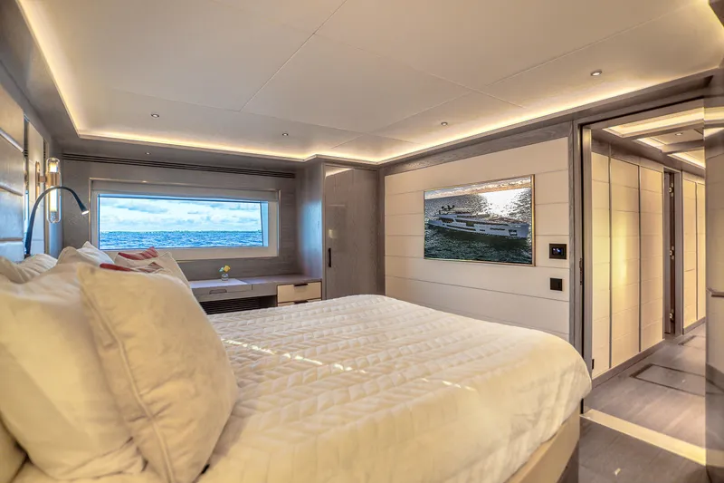 Our Trade Yacht Photos Pics Luxurious Sirena 88 yacht bedroom interior, 2021 model, with ocean view and modern decor.