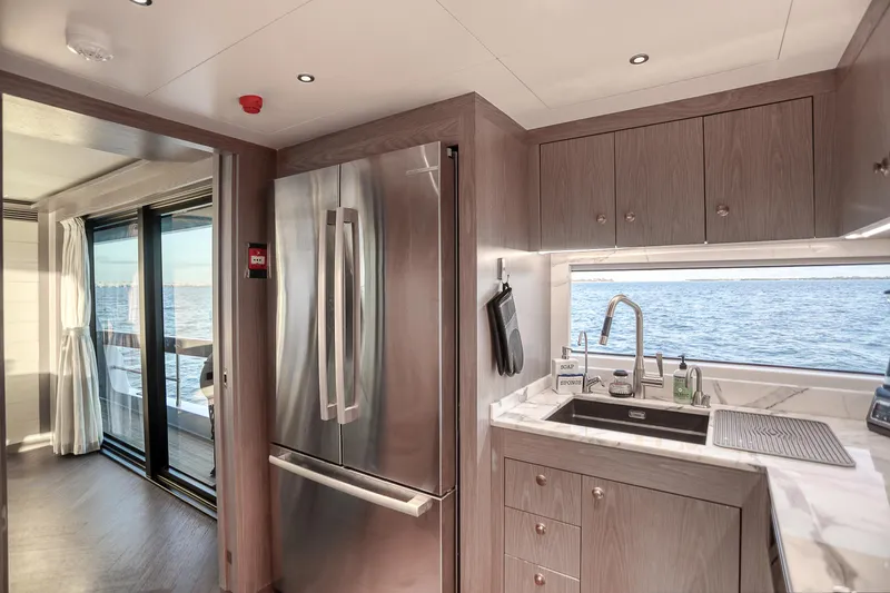 Our Trade Yacht Photos Pics Luxurious Sirena 88 yacht kitchen with modern appliances and ocean view, 2021 model.