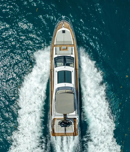  Yacht Photos Pics Aerial view of 2018 Azimut S7 yacht cruising on blue ocean waters.