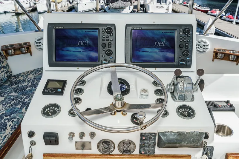  Yacht Photos Pics 1974 Hatteras Convertible Sportfisher helm with dual Furuno displays and classic controls.