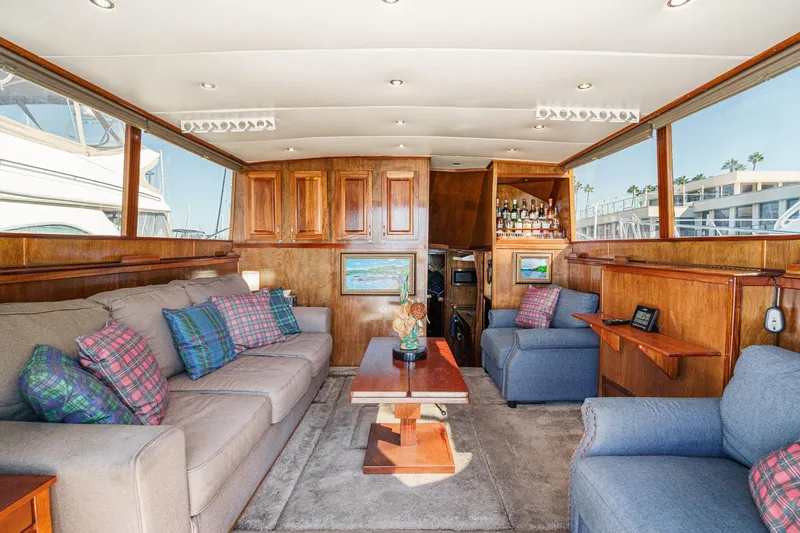  Yacht Photos Pics Luxurious interior of a 1974 Hatteras Convertible Sportfisher with plush seating and wooden accents.