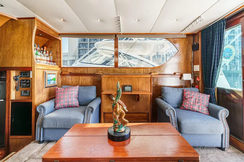  Yacht Photos Pics Interior of a 1974 Hatteras Convertible Sportfisher with cozy seating and nautical decor.