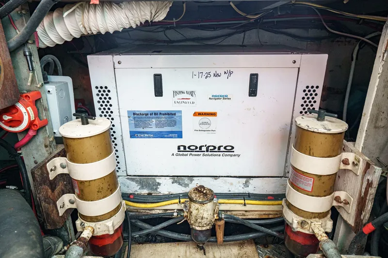 Yacht Photos Pics Engine room of a 1974 Hatteras Convertible Sportfisher with Norpro generator.
