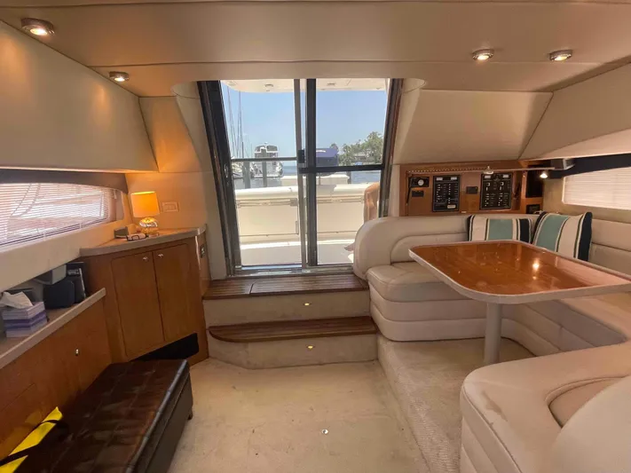 Lost Bouys Yacht Photos Pics Luxurious interior of 2004 Regal Commodore 3880 yacht with plush seating and elegant wood finishes.