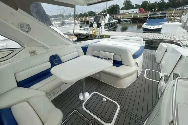  Yacht Photos Pics Luxurious 2006 Fountain 48 Express Cruiser interior with plush seating and sleek design.
