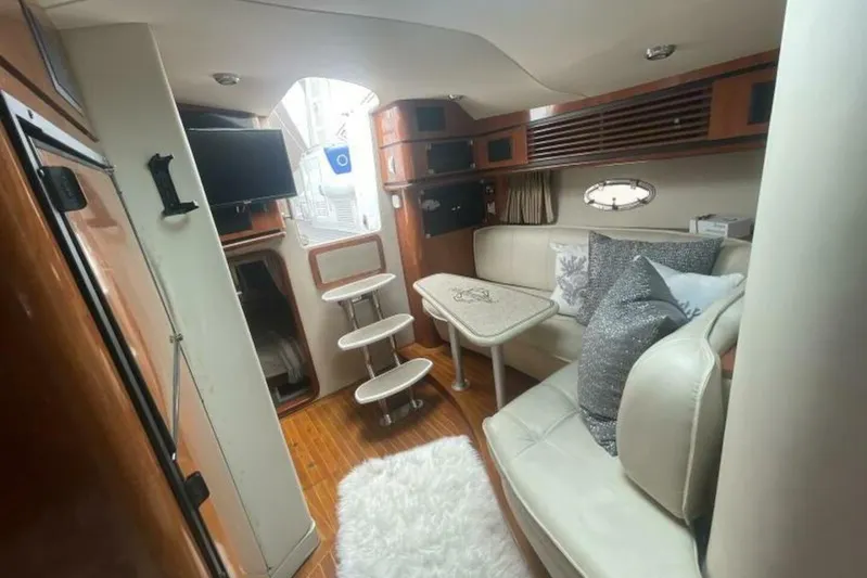 Yacht Photos Pics Interior of 2006 Fountain 48 Express Cruiser with cozy seating and modern amenities.