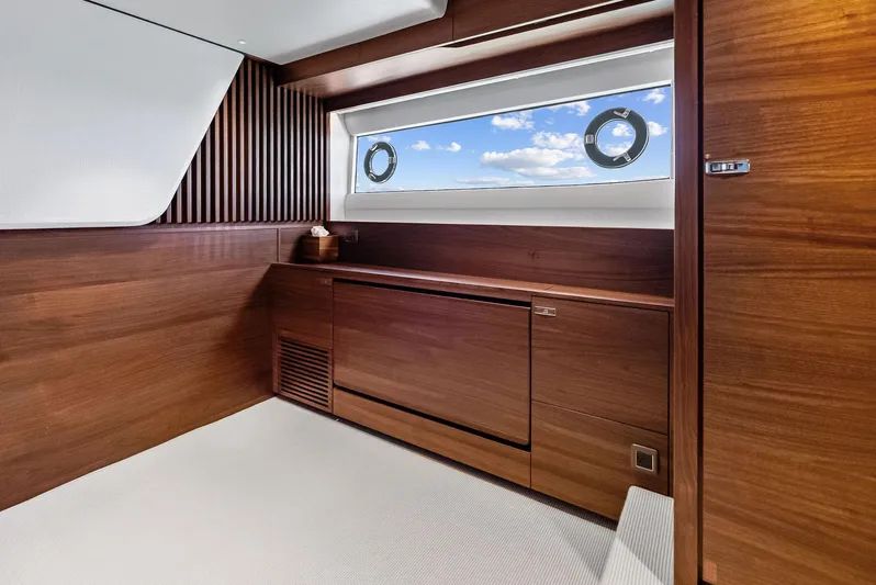 Seaquel Yacht Photos Pics Luxurious interior of 2024 Princess Y72 Motor Yacht with wooden finishes and ocean view.