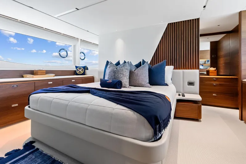 Seaquel Yacht Photos Pics Luxurious bedroom interior of 2024 Princess Y72 Motor Yacht with elegant decor and ocean view.
