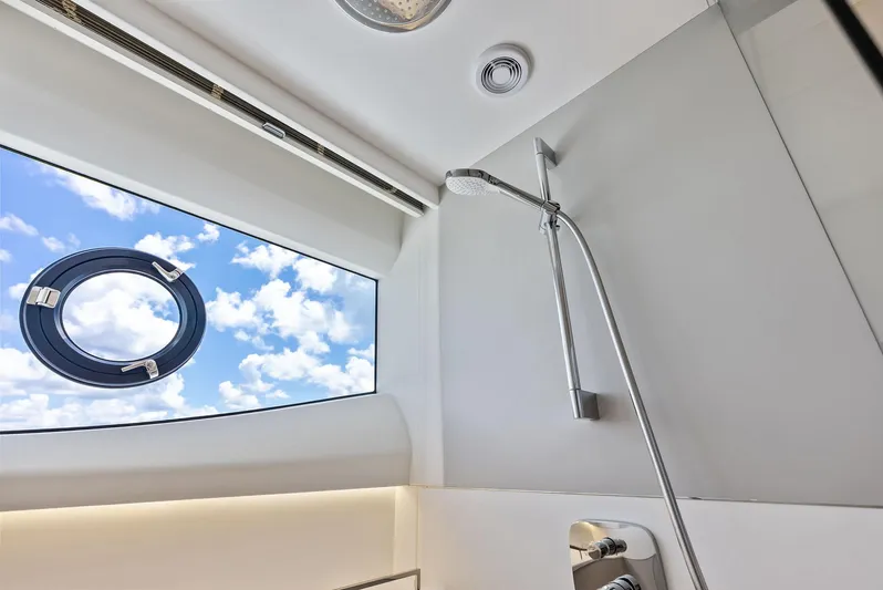 Seaquel Yacht Photos Pics Luxurious shower area in 2024 Princess Y72 Motor Yacht with sky view window.