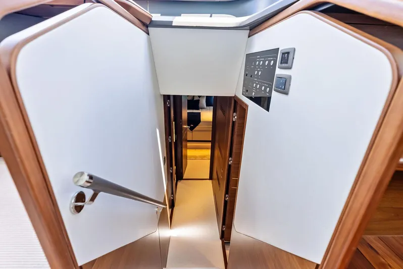 Seaquel Yacht Photos Pics Stairway inside 2024 Princess Y72 Motor Yacht, featuring sleek wood and modern design.