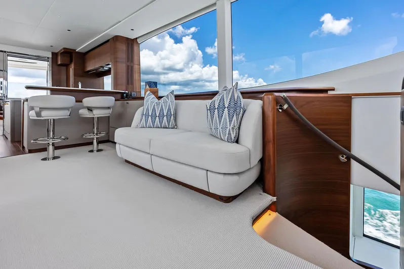 Seaquel Yacht Photos Pics Luxurious interior of 2024 Princess Y72 Motor Yacht with modern seating and ocean view.