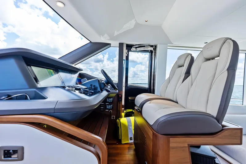Seaquel Yacht Photos Pics 2024 Princess Y72 Motor Yacht helm with luxurious seating and modern controls.