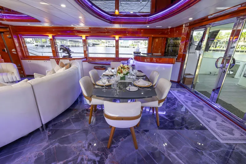 Kaya Yacht Photos Pics Luxurious yacht interior with elegant dining area, Johnson 87 model, 2003.