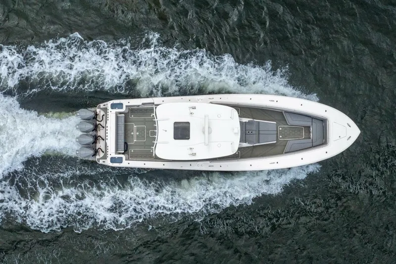 Bramate Yacht Photos Pics Aerial view of 2023 Blackwater High-Performance boat cruising on water.