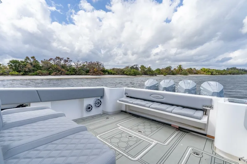 Bramate Yacht Photos Pics 2023 Blackwater High-Performance boat interior with luxurious seating and powerful engines on a scenic waterway.