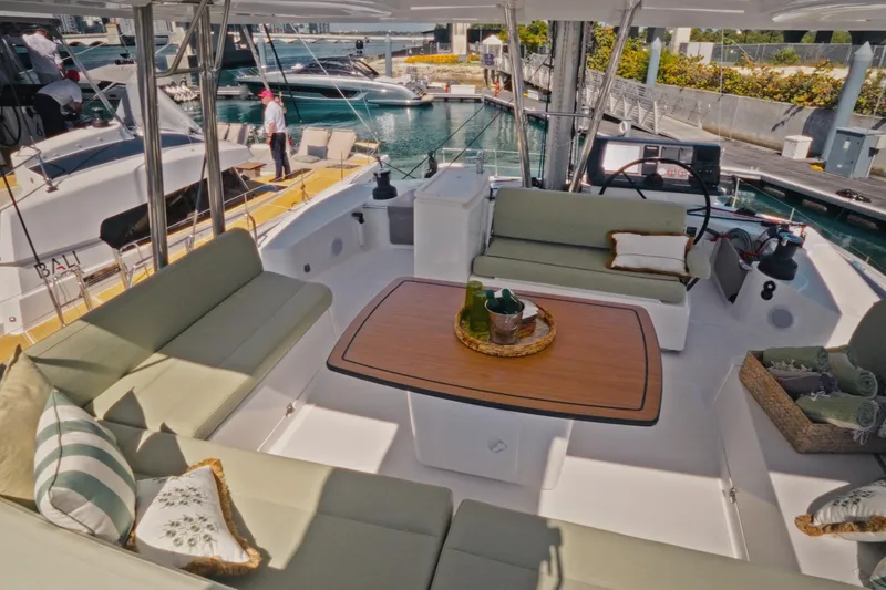 Stills Yacht Photos Pics Luxurious 2026 Bali 5.2 yacht interior with elegant seating and wooden table.