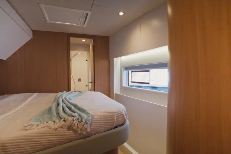 Stills Yacht Photos Pics Luxurious cabin interior of 2026 Bali 5.2 yacht with cozy bed and modern design.