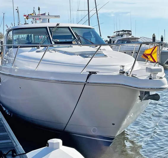 Ocho Yacht Photos Pics 2009 Tiara Yachts 4300 Sovran docked at marina, showcasing sleek design and luxury features.