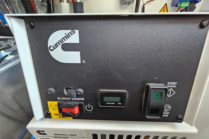 Shadow Yacht Photos Pics Cummins generator control panel with switches and hour meter, Prestige F4 2024 model.