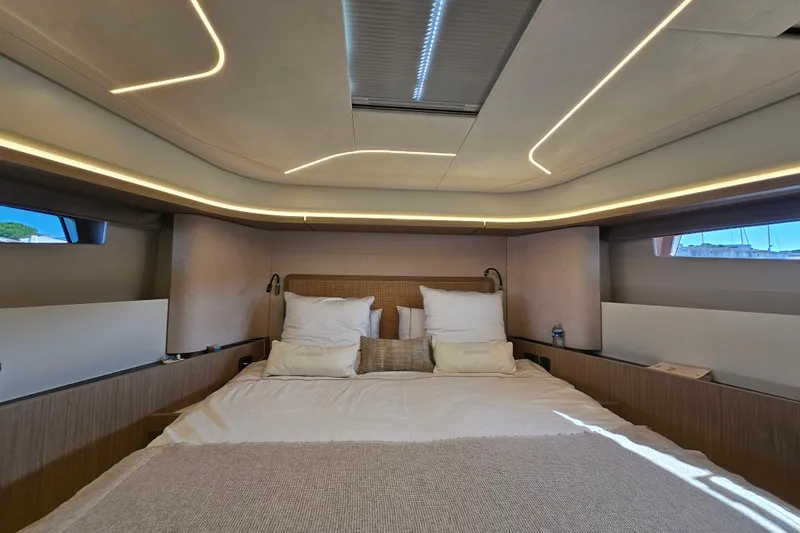 Shadow Yacht Photos Pics Luxurious interior of 2024 Prestige F4 yacht with modern lighting and cozy bedding.
