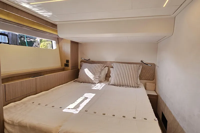 Shadow Yacht Photos Pics Luxurious cabin interior of 2024 Prestige F4 yacht with cozy bedding.