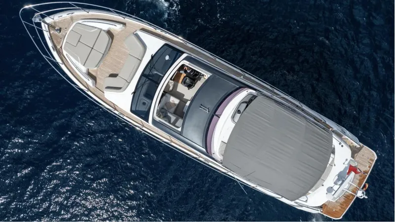  Yacht Photos Pics Aerial view of 2022 Princess S66 luxury yacht cruising on the ocean.